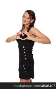 a young woman in a black evening dress showing a heart sign with her fingers