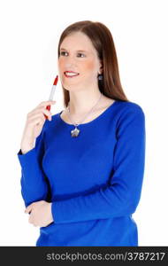 A young woman in a blue sweater holding a red marker in her handisolated for white background.