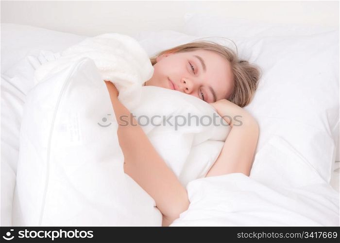 a young woman in bed just woke up