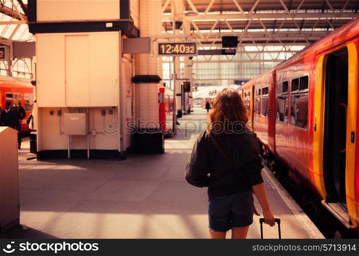 A young woman is about to board a train