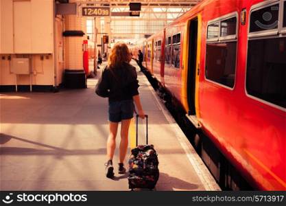 A young woman is about to board a train