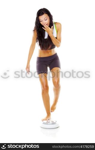a young woman is dissatisfied with your body weight. trying to be lighter on the scales.