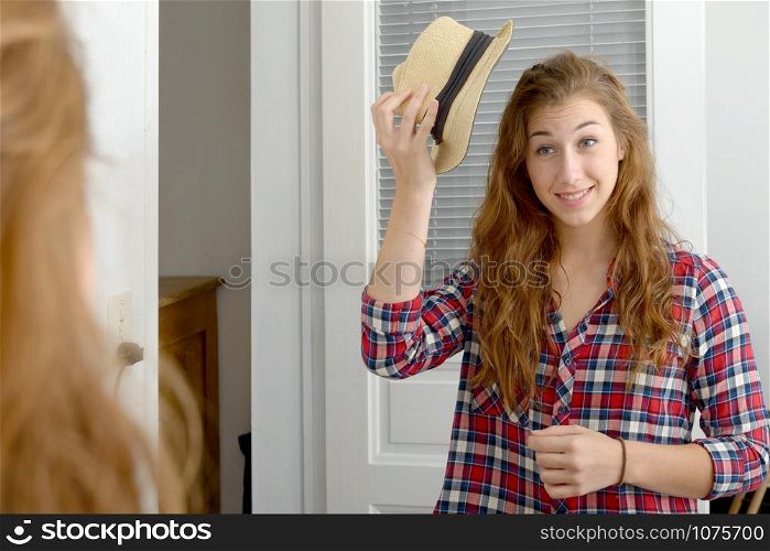 A young woman looking in a mirror
