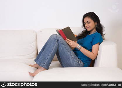 A young woman reading a book