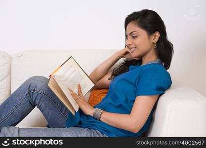 A young woman reading a book