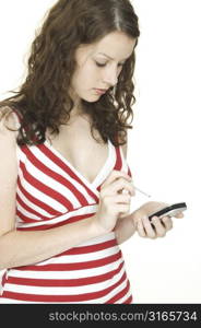 A young woman uses a pocket pc to stay organised