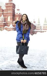 A young woman walking on the Red Square in Moscow