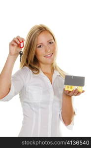 a young woman with a model house and apartment keys.