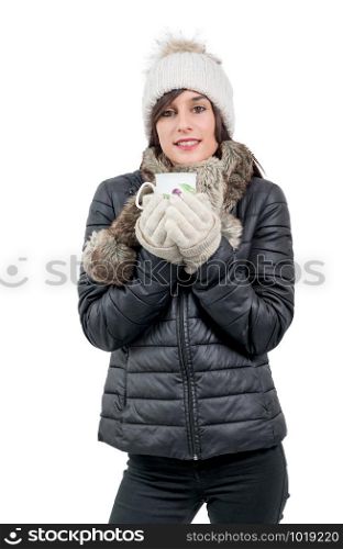a young woman with winter cap drinking cup of tea