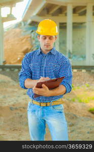 a young worker writing in clipboard