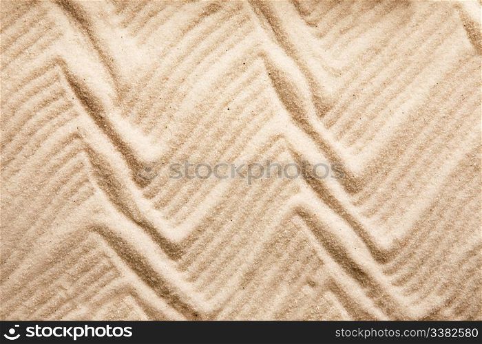 A zig zag background pattern in sand