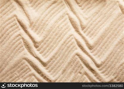 A zig zag background pattern in sand