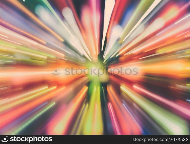 Aabstract blurred colorful lights trail background using motion zoom burst technique