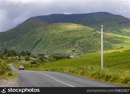 Aasleagh. Ireland. 06.17.16. Country road and mountain scenery near Aasleagh in County Mayo in the Republic of Ireland.