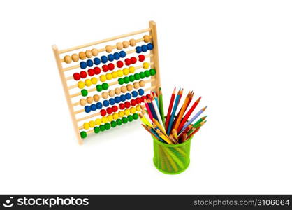 Abacus and pencils isolated on white