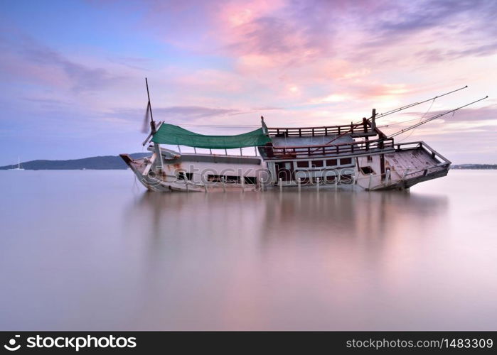 Abandoned boat with beautiful sky in sunrise ,thailand