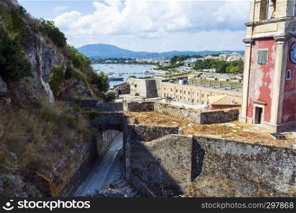 Abandoned clock tower in old fortress in Corfu with panoramic view of Corfu town at Greece.. Abandoned clock tower in old fortress in Corfu with panoramic view of Corfu town, Greece.