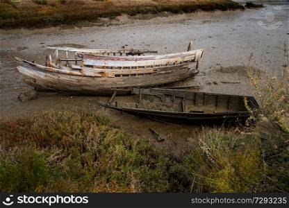 abandoned decrepit boat in the river sw&
