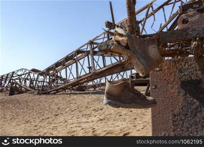 Abandoned Engineering - Rusting infrastructure of an old oil rig on the Skeleton Coast in Namibia, Africa.