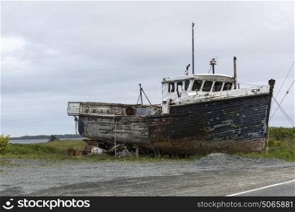 Abandoned fishing trawler at harbor, Marie Joseph, Nova Scotia, Canada