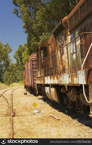 Abandoned freight train on railroad track