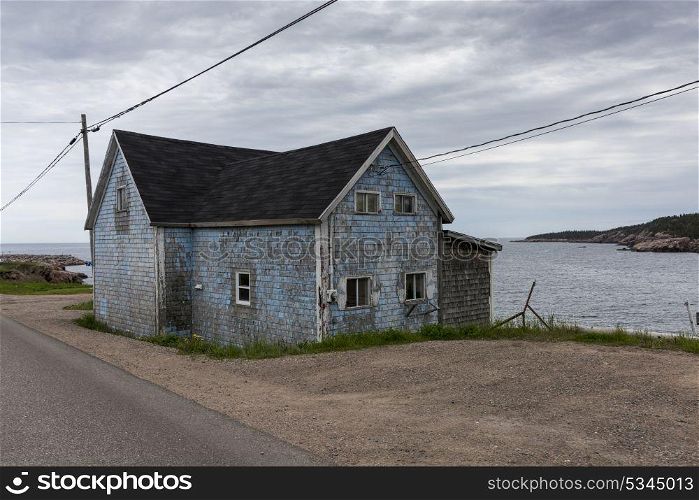 Abandoned house at waterfront, Cabot Trail, Cape Breton Island, Nova Scotia, Canada