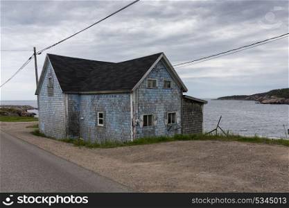 Abandoned house at waterfront, Cabot Trail, Cape Breton Island, Nova Scotia, Canada