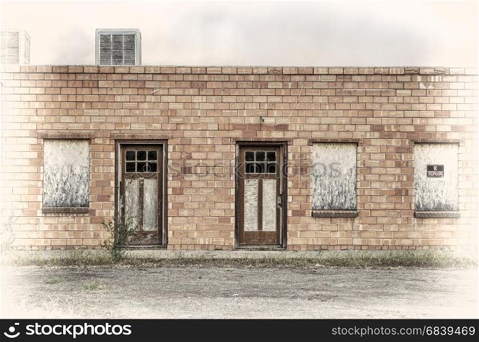 abandoned motel in a ghost town in eastern Utah, image processed a s a hand tinted opalotype