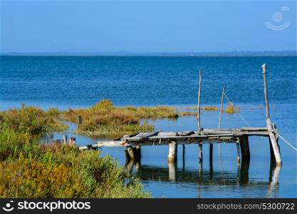 abandoned old fishing dock lin calm water in comporta, alentejo Portugal.