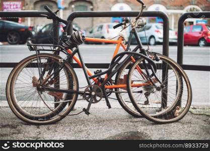 abandoned old rusty bicycles on city streets