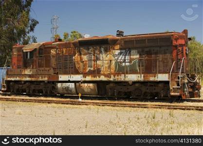 Abandoned train engine on railroad track