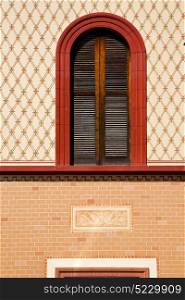 abbiate varese italy abstract window in the church and venetian blind