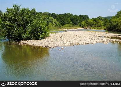 Abin mountain river near Shapsugskaya village in the North Caucasus region in sunny summer day