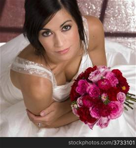 Above Beautiful Female Bride White Gown Holding Floral Bouquet