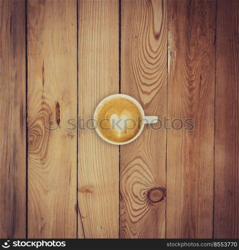 above coffee on wood texture and background with space.