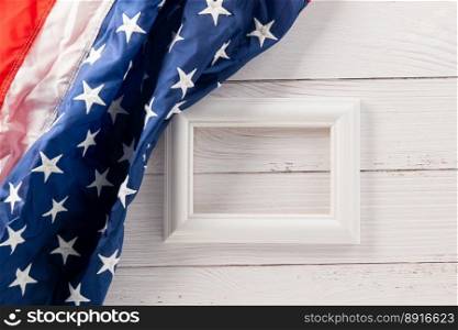 Above flag of United States American with photo frame, USA flag for Memorial day on abstract wooden background, Banner template design of presidents day concept, holiday background