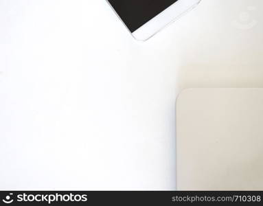 Above view of communicators device on desk, mobile phone and laptop. Rafa Fernandez