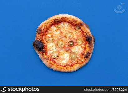 Above view with a homemade vegetarian pizza minimalist on a blue table. Delicious pizza with wild edible mushrooms, mozzarella and tomato sauce.