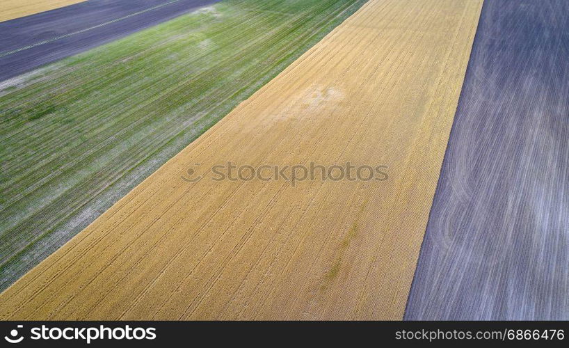 abstract aerial view of rural Nebraska - plowed, wheat and corn fields