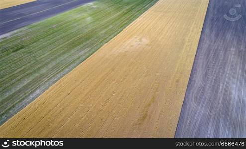 abstract aerial view of rural Nebraska - plowed, wheat and corn fields