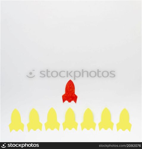 abstract arrangement with paper rockets white background