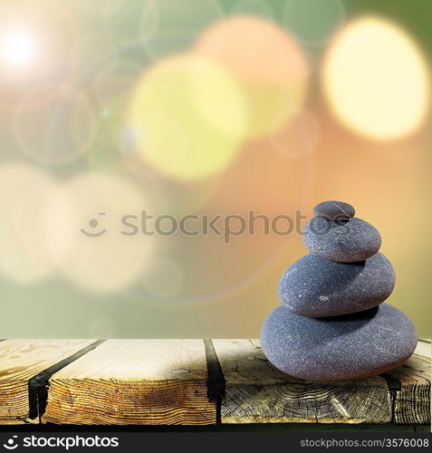 Abstract asian backgrounds with pebble over wooden desk