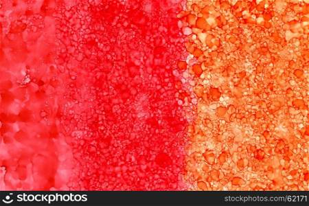 Abstract backdrop red orange smudges.Colorful painted background hand drawn with bright inks and watercolor paints. Bright color splashes and splatters create uneven artistic background.