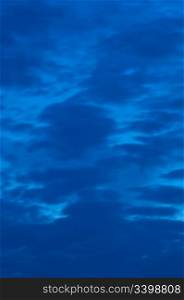 Abstract Background - Blurry Clouds on Blue Evening Sky Before Storm