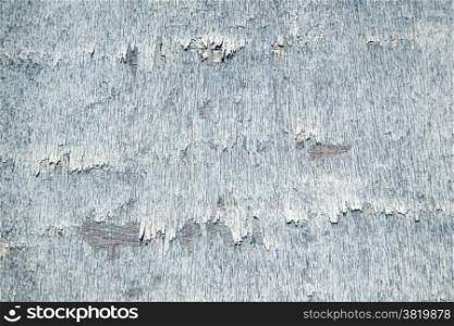 abstract background consisting of weathered board with old blue paint
