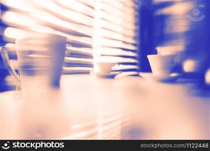 Abstract background duo tone coffee cups on the table lines defocused blurred