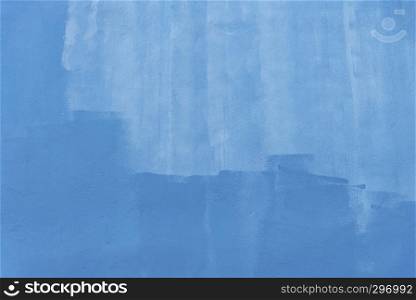 Abstract background from blue brush stroke painted on concrete wall. Vintage and retro art backdrop.