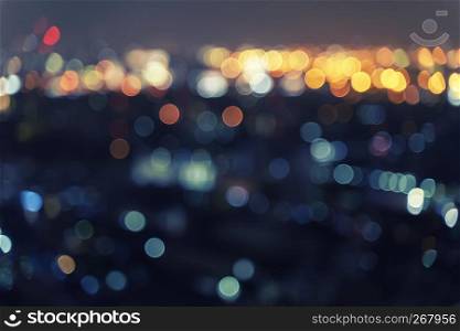 Abstract background from blurred bokeh light at night in the city.
