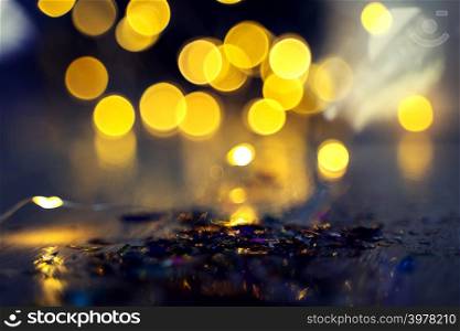 Abstract background from blurred light in dark background. Holiday and festival party backdrop.