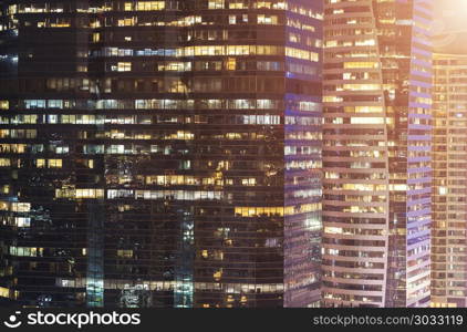 Abstract background from closeup photo of glasses window in modern building at night. Business and finance background.